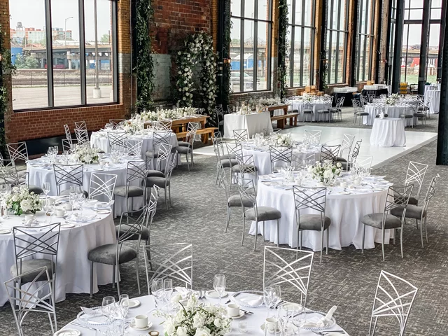 Round tables and chairs set up for a wedding at The Powerhouse