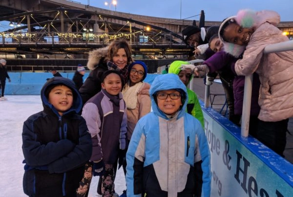 Kids posing for camera at Ice at Canalside