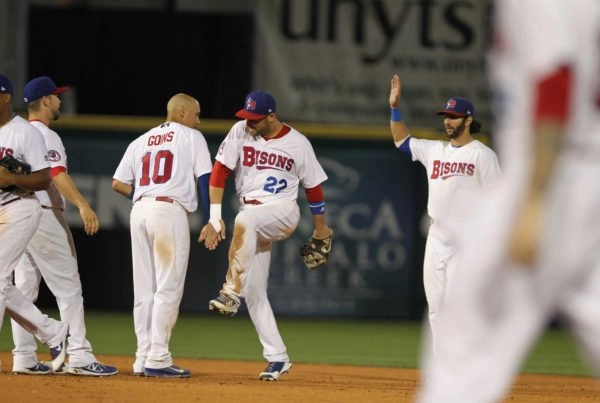 Bisons players high five each other