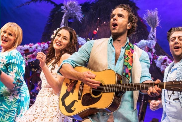 Actors on stage at Escape to Margaritaville