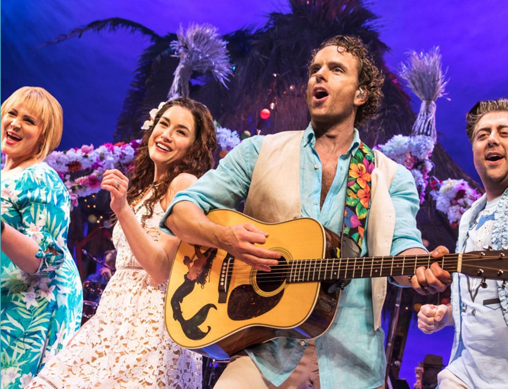Actors on stage at Escape to Margaritaville