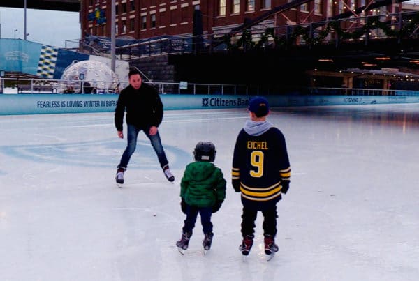 Mickey family ice skating at Canalside